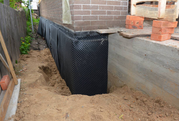 Happy homeowners after waterproofing job in Tiffin